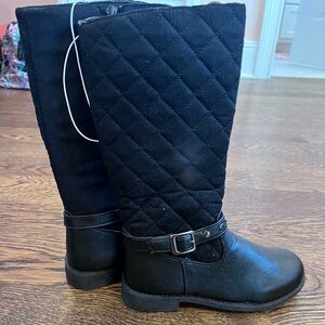 Never been worn boots for $12 in the color black.